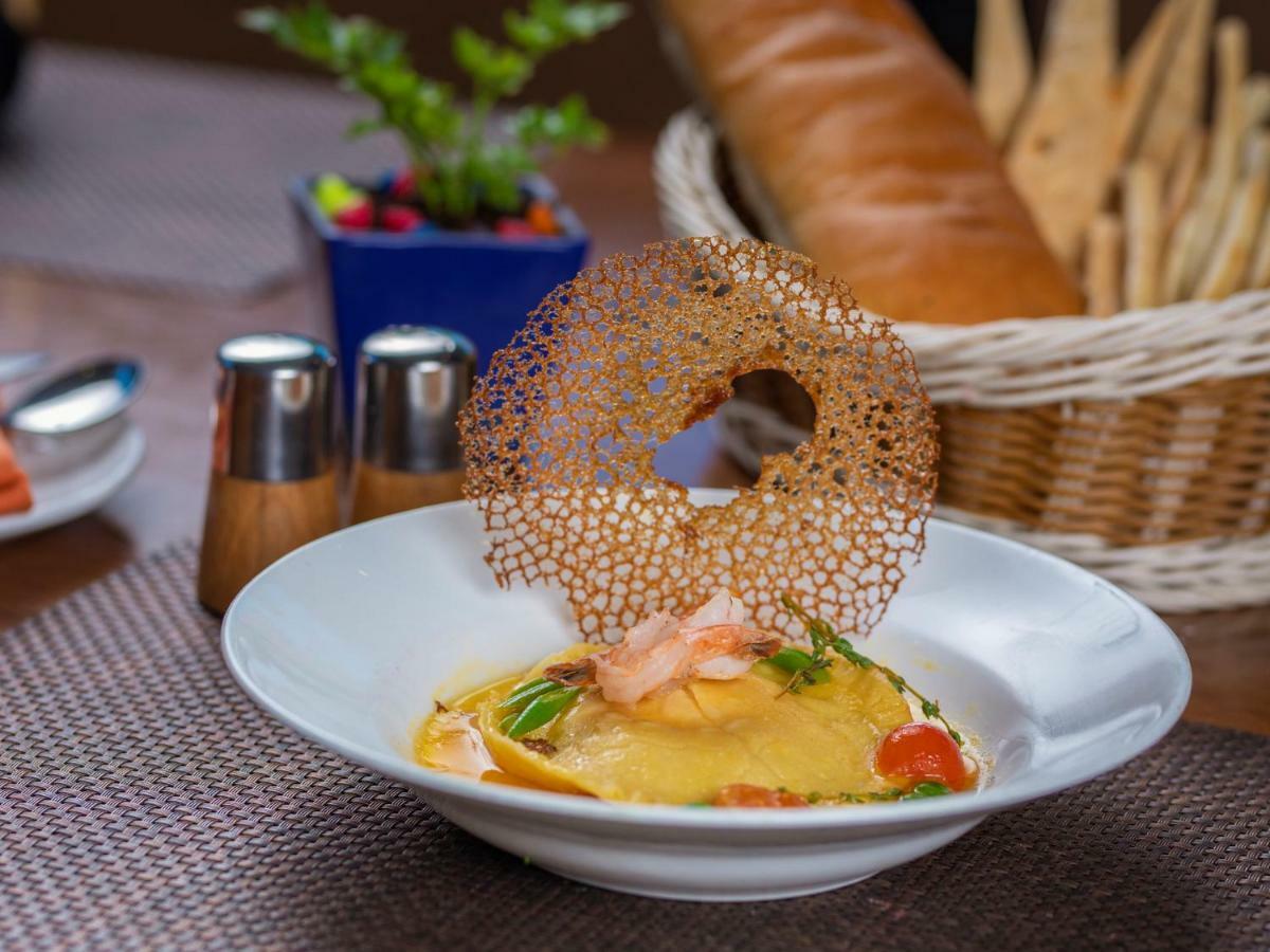 The Orchid Hotel Hinjewadi Pune Exterior foto A prawn and mango salad